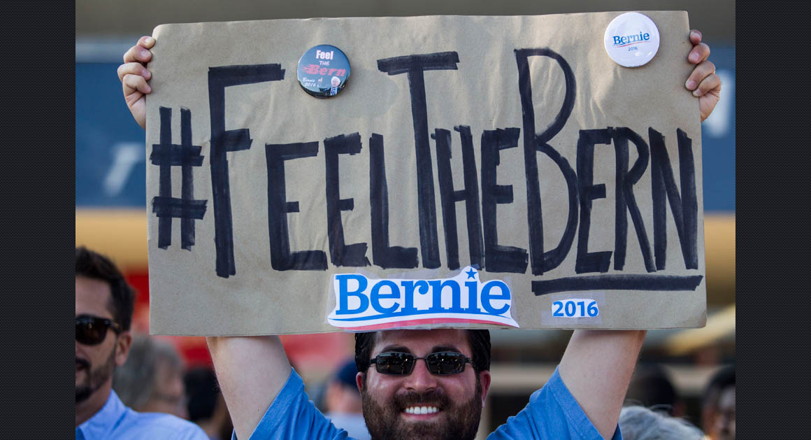 Feel The Bern - Frank Rothstein holds a sign before a rally for Democratic presidential candidate Sen. Bernie Sanders, I-Vt., Monday, Aug. 10, 2015, at the Los Angeles Memorial Sports Arena in Los Angeles. (AP Photo/Ringo H.W. Chiu)